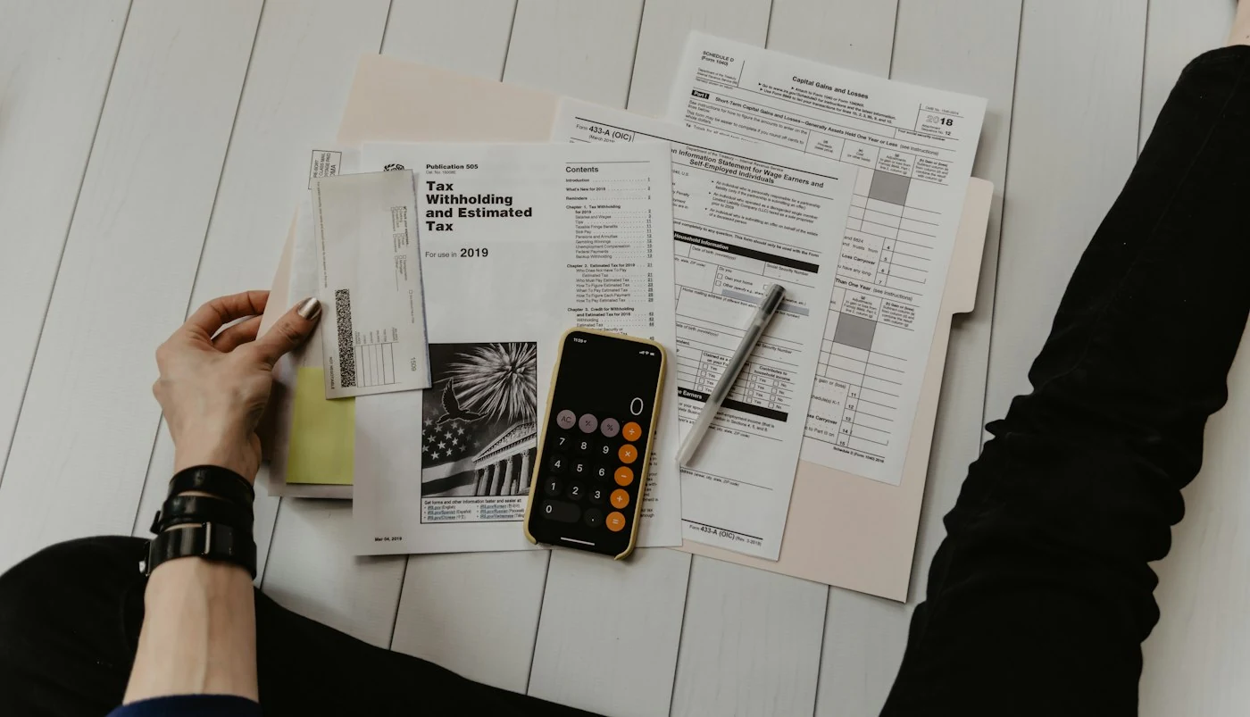 Receipts, invoices and a calculator arranged for review
